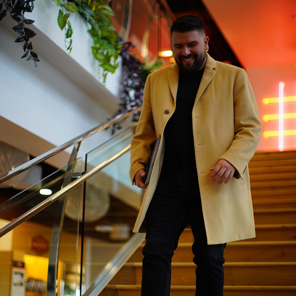 man walking down stairs